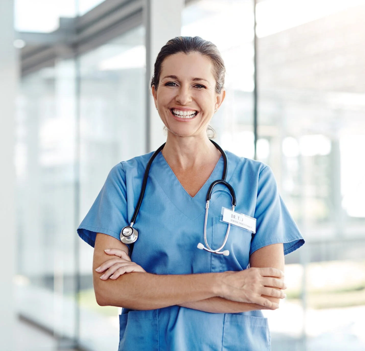 Doctor wearing scrubs with stethoscope